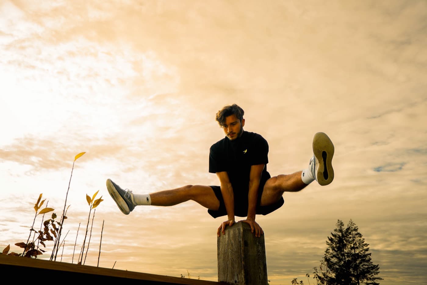 Niko vaulting a post at sunset